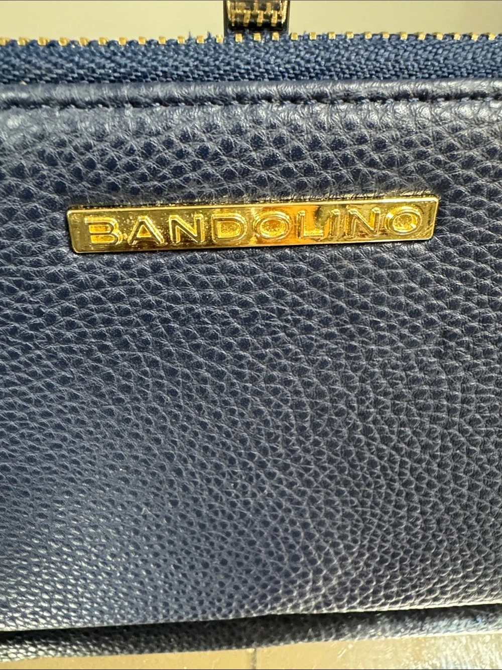 Bandolino Navy Pebbled Zip Wristlet with Gold Plaque